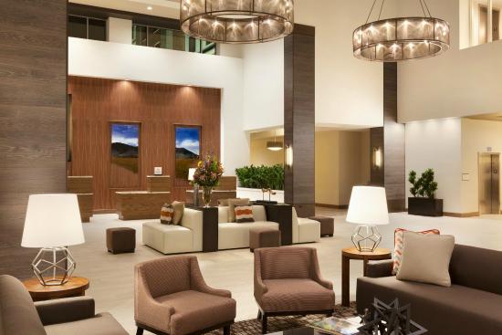 Cohesion through color and conversation makes the main entrance to both the Embassy Suites Medical Center, Oklahoma City, foyer and dining area both inviting and elegant.  It has a quiet confidence that says class without pretense.